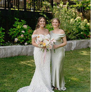 Beautiful bride posing outdoors in her perfect wedding dress